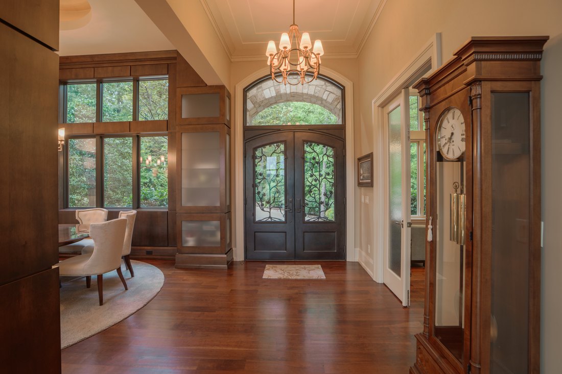 Flagstone foyer and arched front door