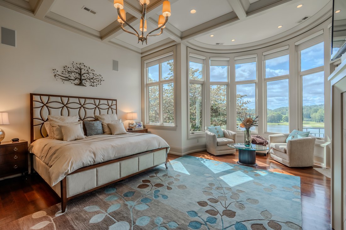 Primary suite under a coffered ceiling