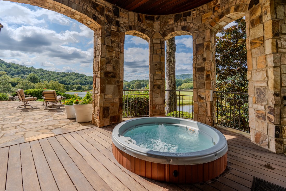 Hot tub inside a colonnade of stone arches